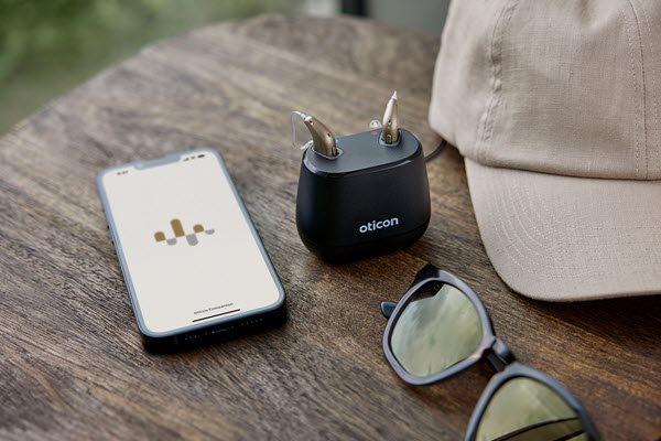 Oticon_Intent_Still_Life_miniRITE_Charger_iPhone_Sunglasses